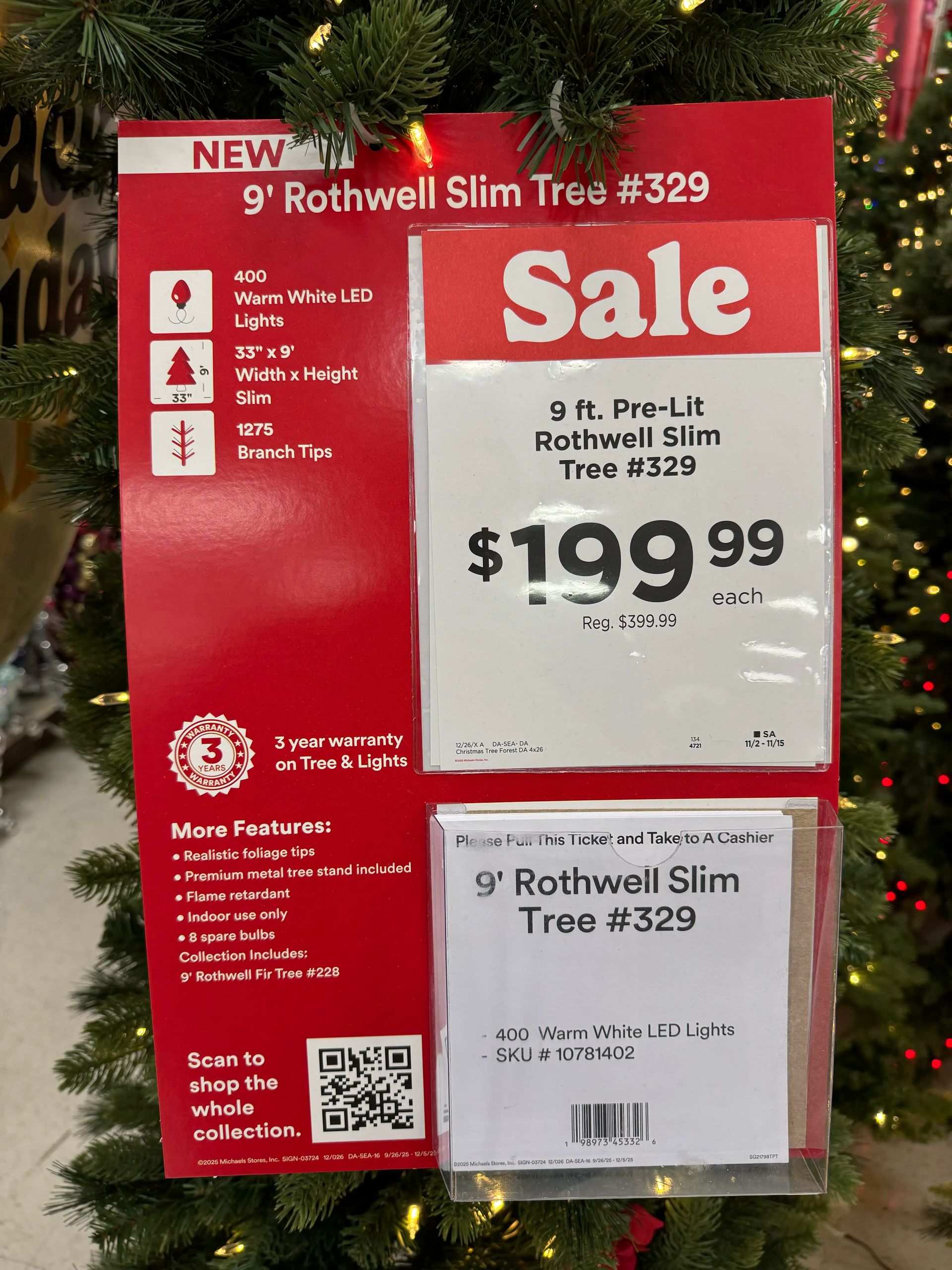 Product tag showing 9ft slim tree specs: 400 warm white LEDs, 1275 branch tips, sale price $199.99