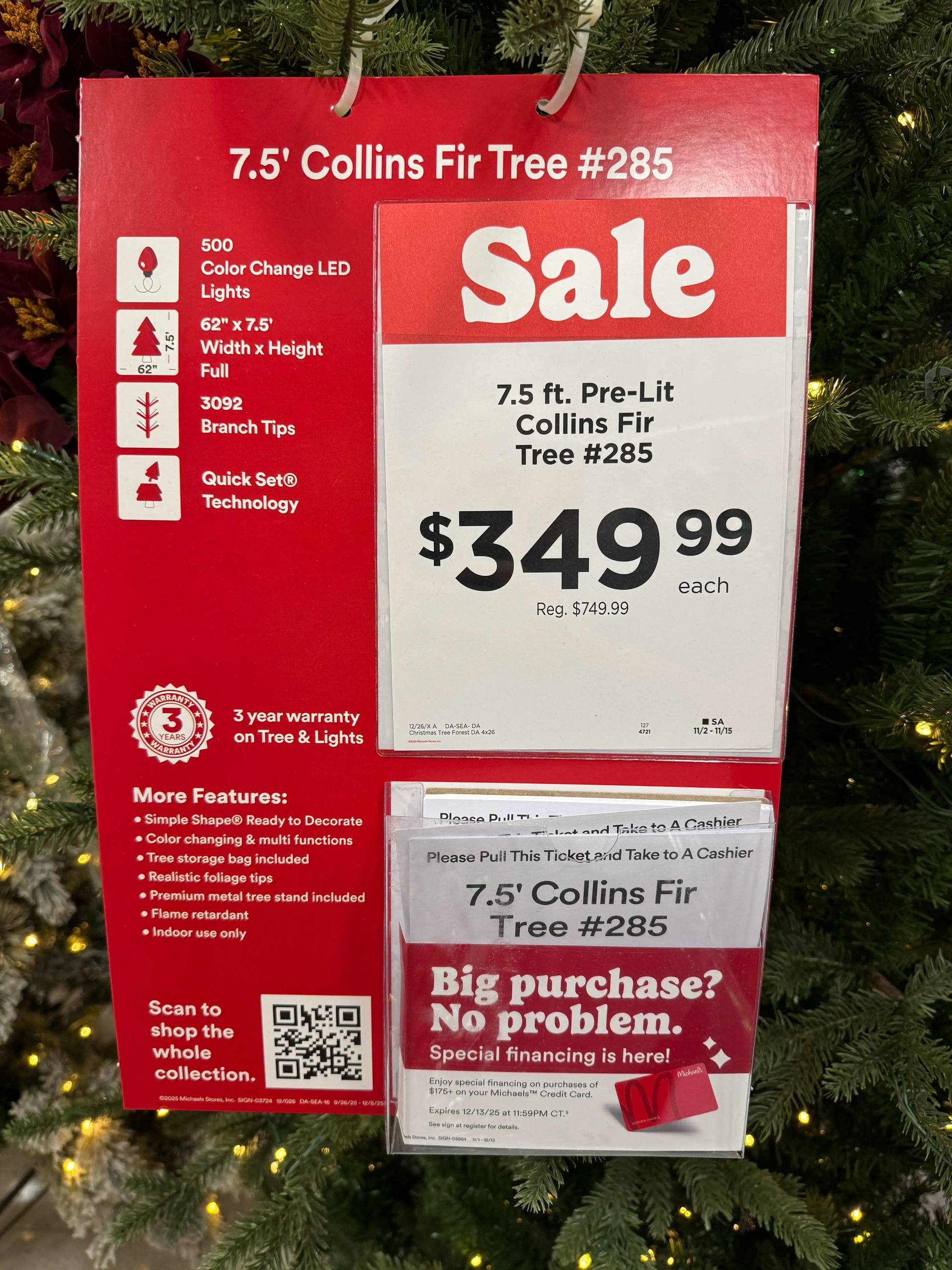 Sale sign for 7.5ft Collins Fir showing $349.99 (reg $749.99), 500 color-change LEDs, 3092 tips, Quick Set technology