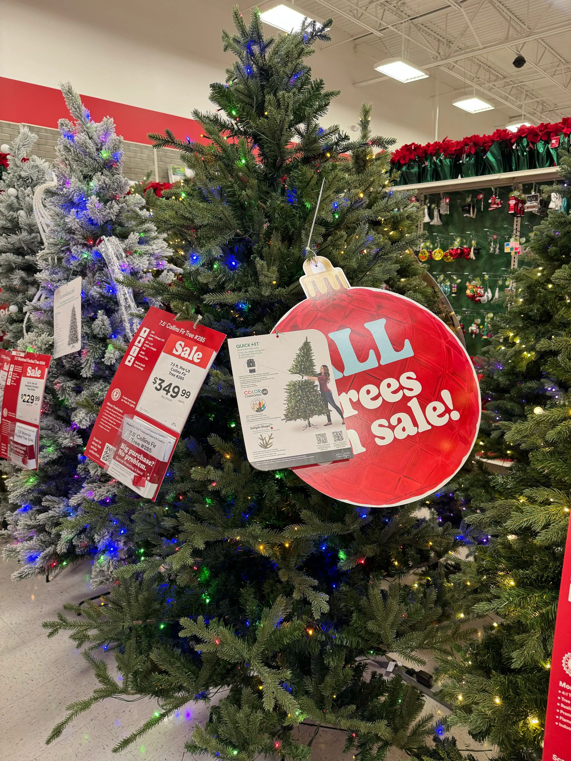 Full fir-style tree with mixed PVC/PE needles, moderate density, multicolor mini bulbs throughout, natural green color