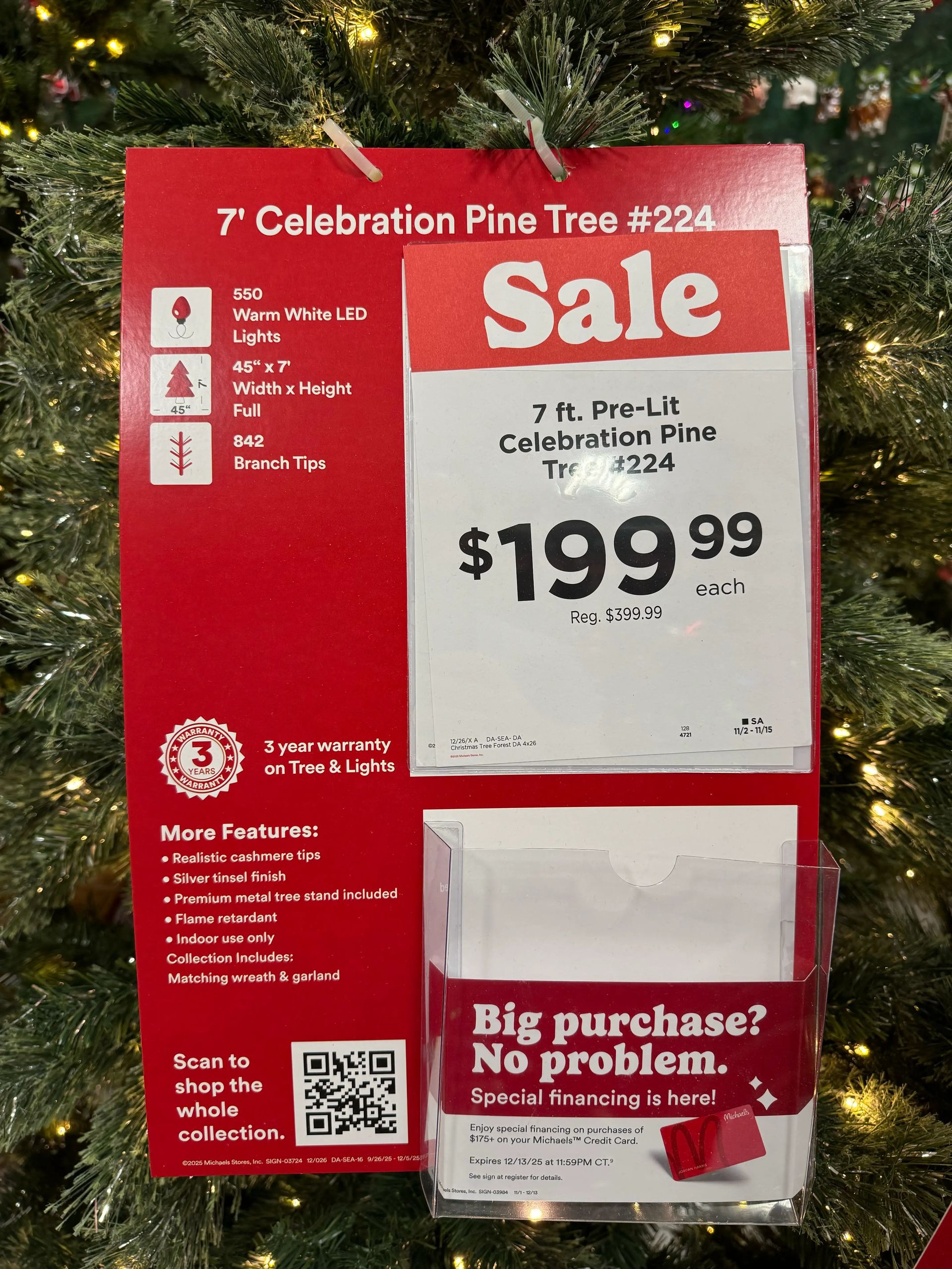 Product sign showing 7ft Celebration Pine specs: 550 warm white LEDs, 45x7in, 842 tips, sale price $199.99