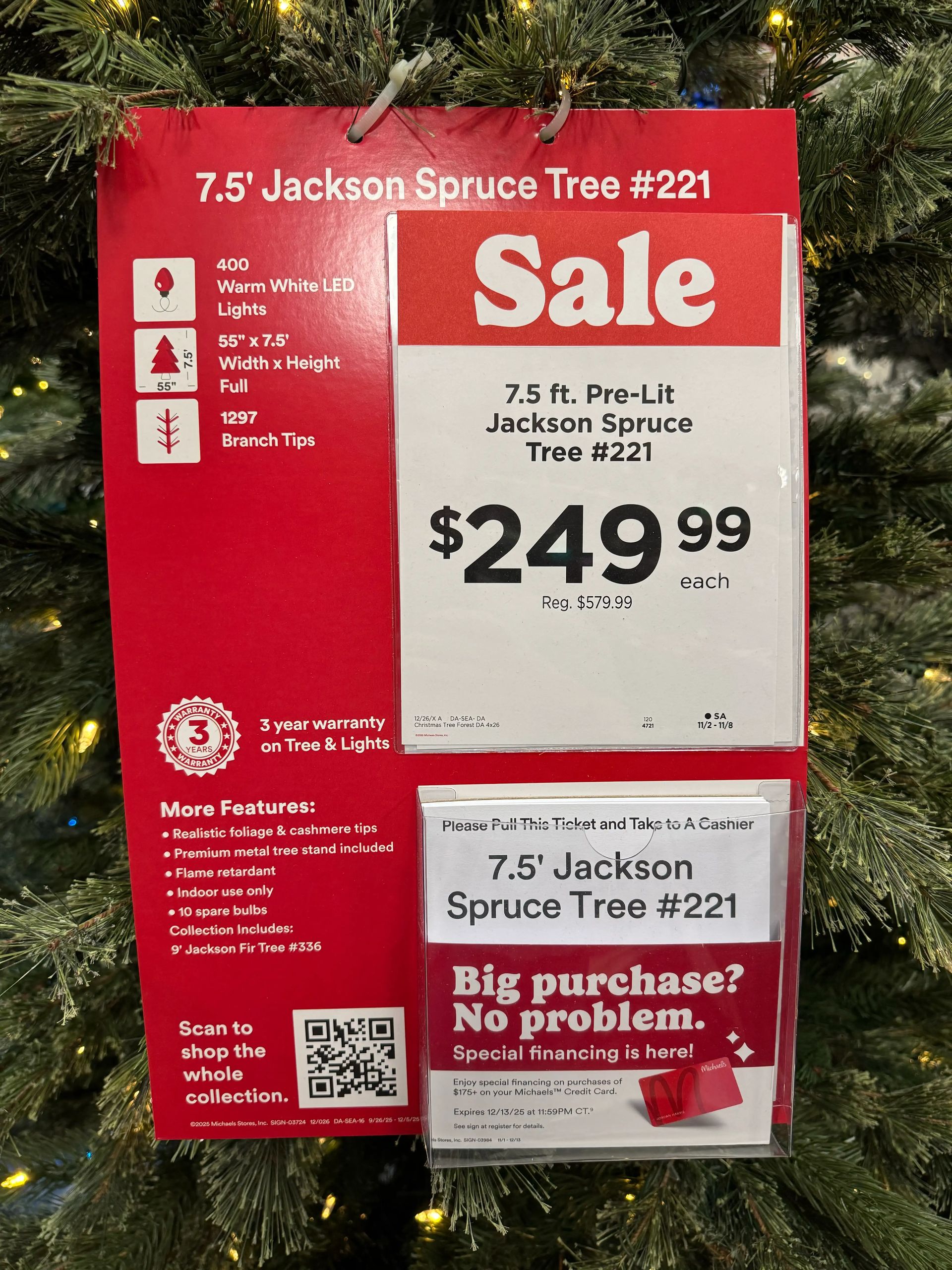 Sale tag for 7.5ft pre-lit tree: $249.99 (reg $579.99), 400 warm white LEDs, 1297 tips, 55in width, 3-year warranty