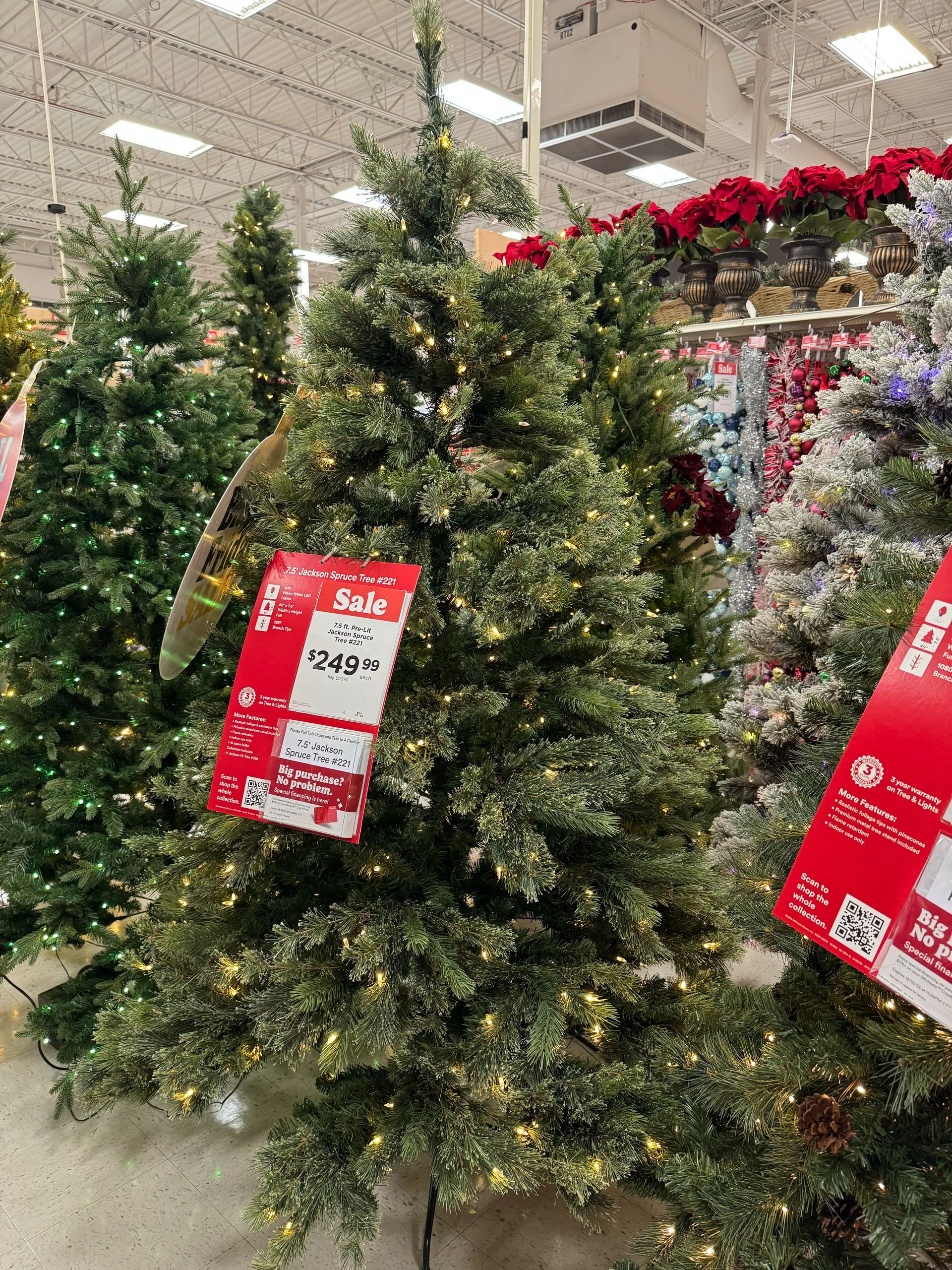 Full spruce-style tree with mixed PVC needles, moderate branching with some gaps, warm white mini bulbs evenly distributed