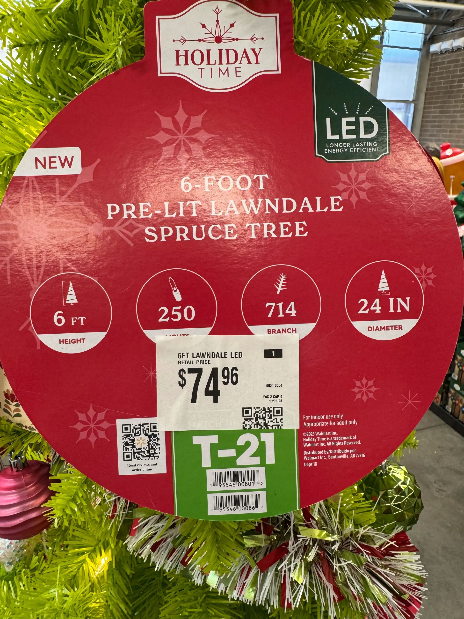 Product tag showing 6ft tree specs: 24in diameter, 250 lights, 714 branch tips, LED, $74.96 retail price