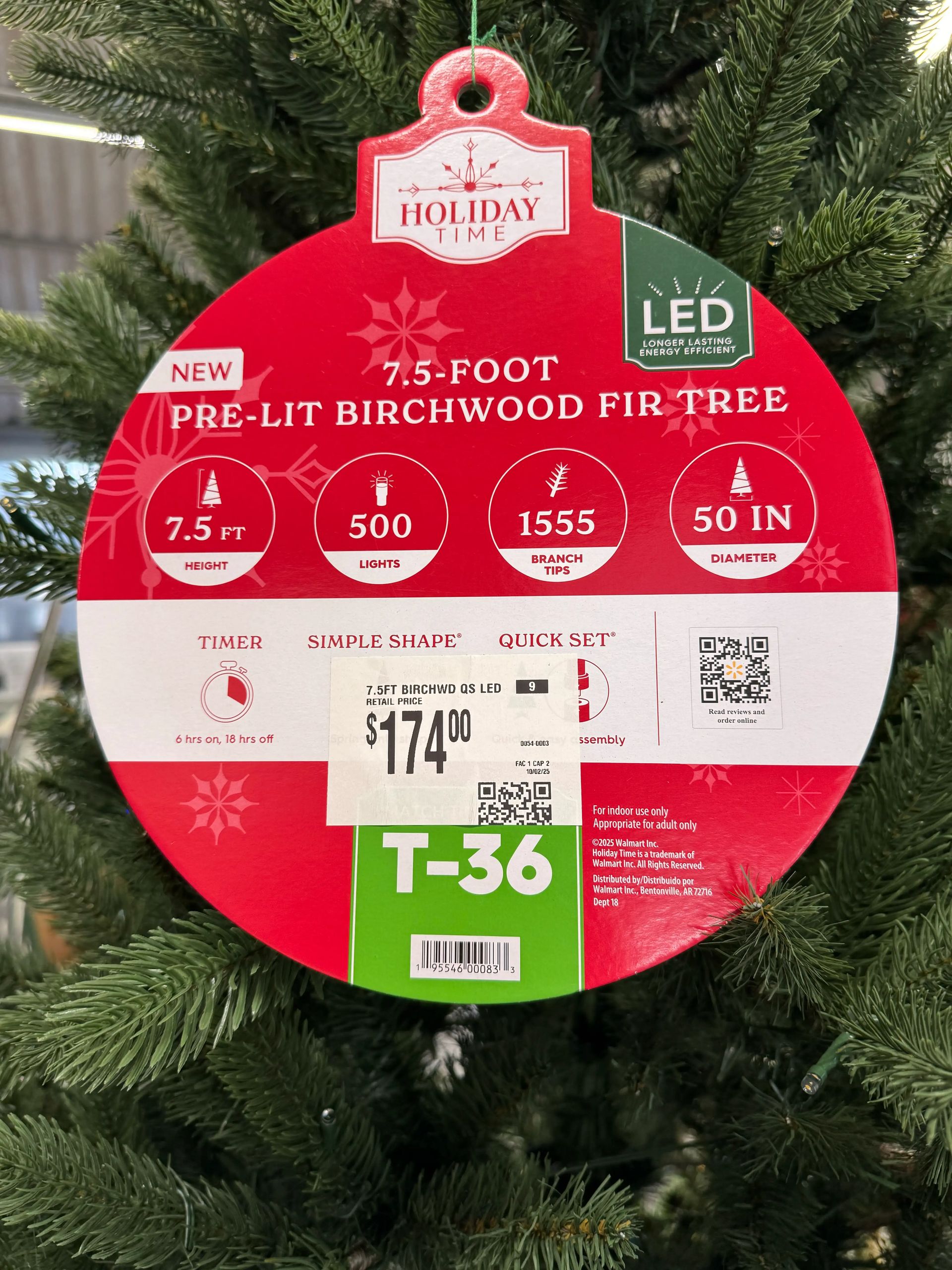 Product tag showing 7.5ft pre-lit birchwood fir specs: 500 lights, 1555 branch tips, 50in diameter, $174