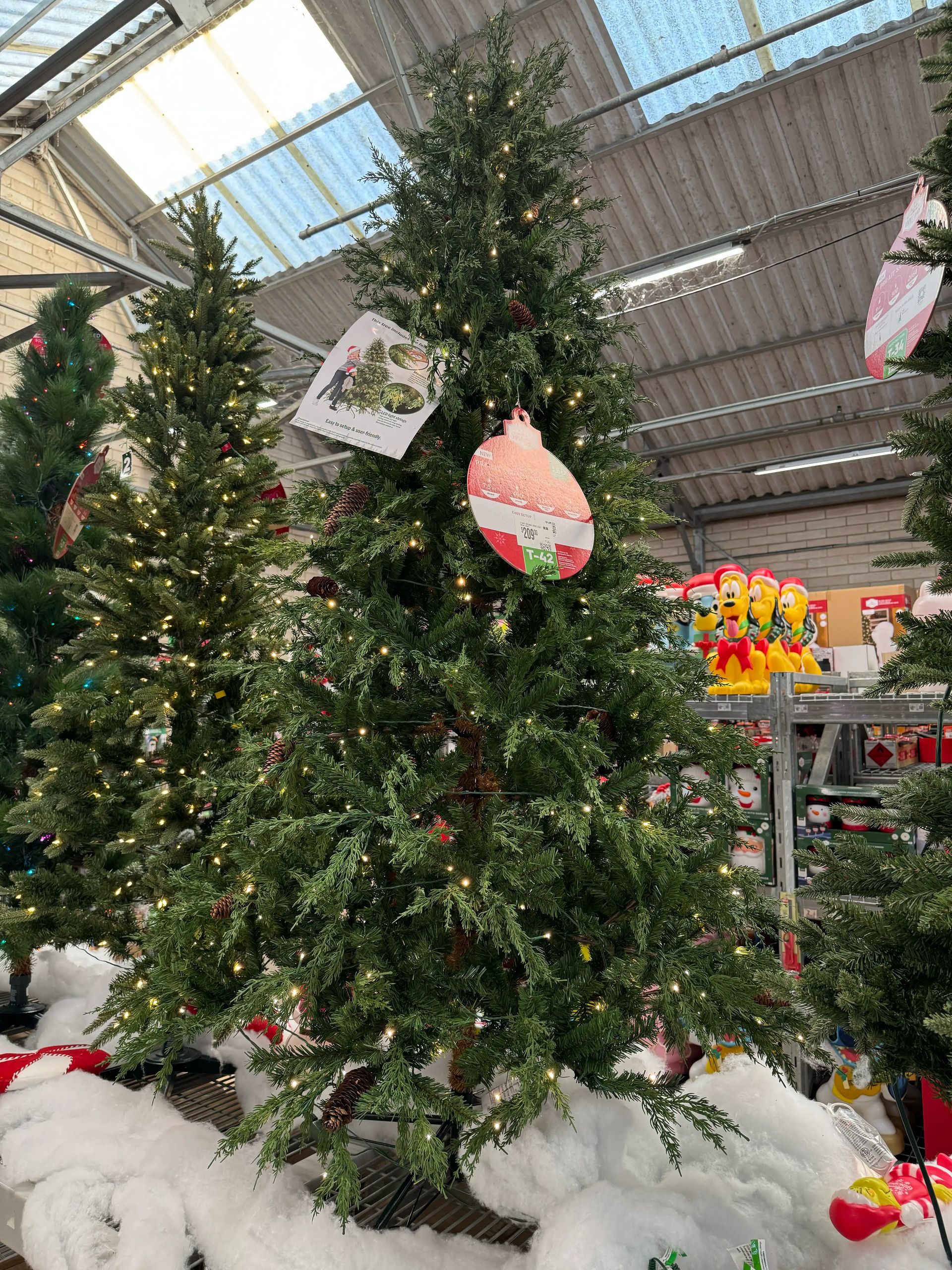 Dense mixed PVC/PE cypress-style tree, minimal gaps, warm white lights evenly distributed throughout branches