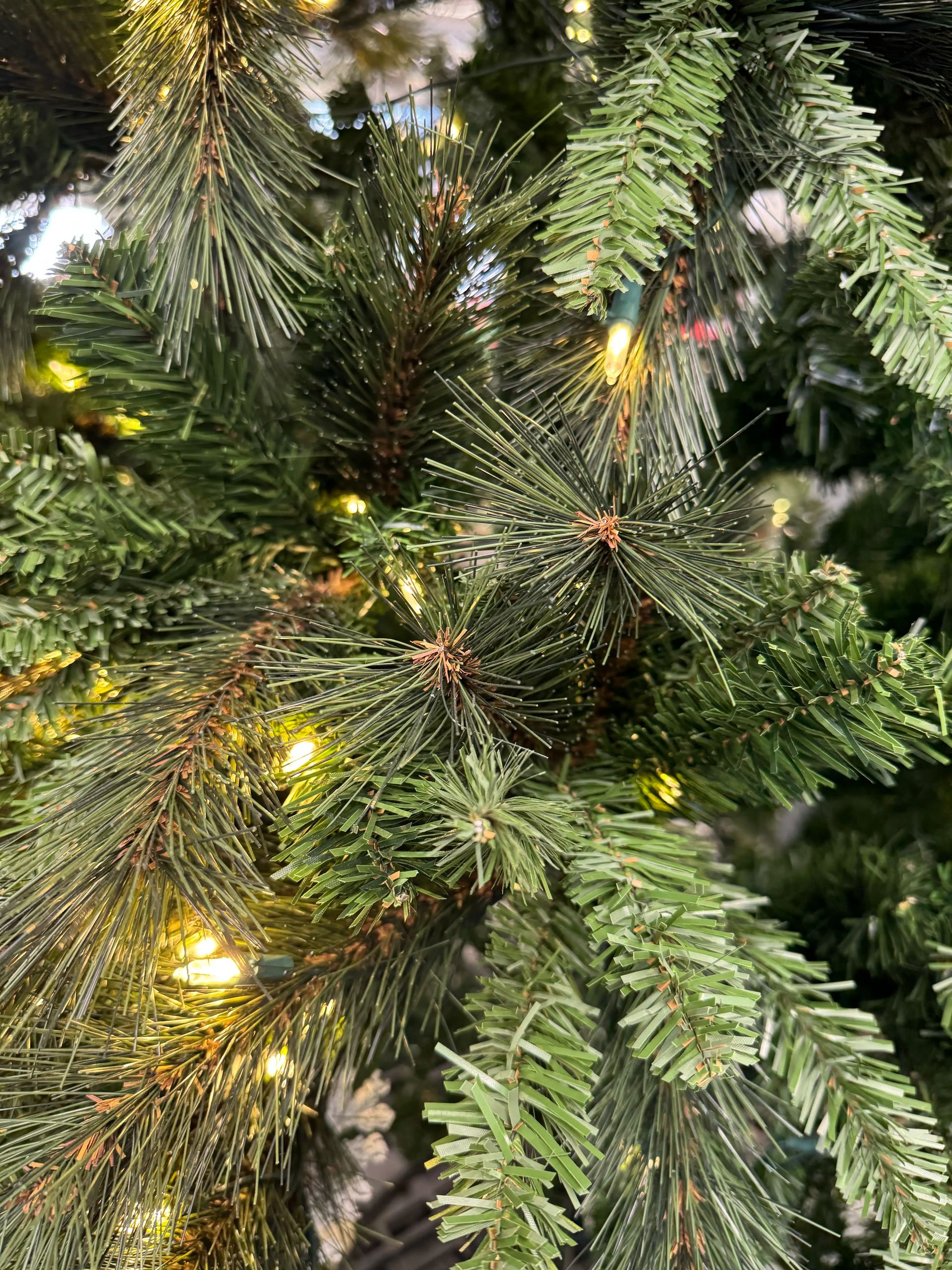 Mixed PVC needles with long pine-style tips and traditional branches, warm white mini bulbs, moderate spacing