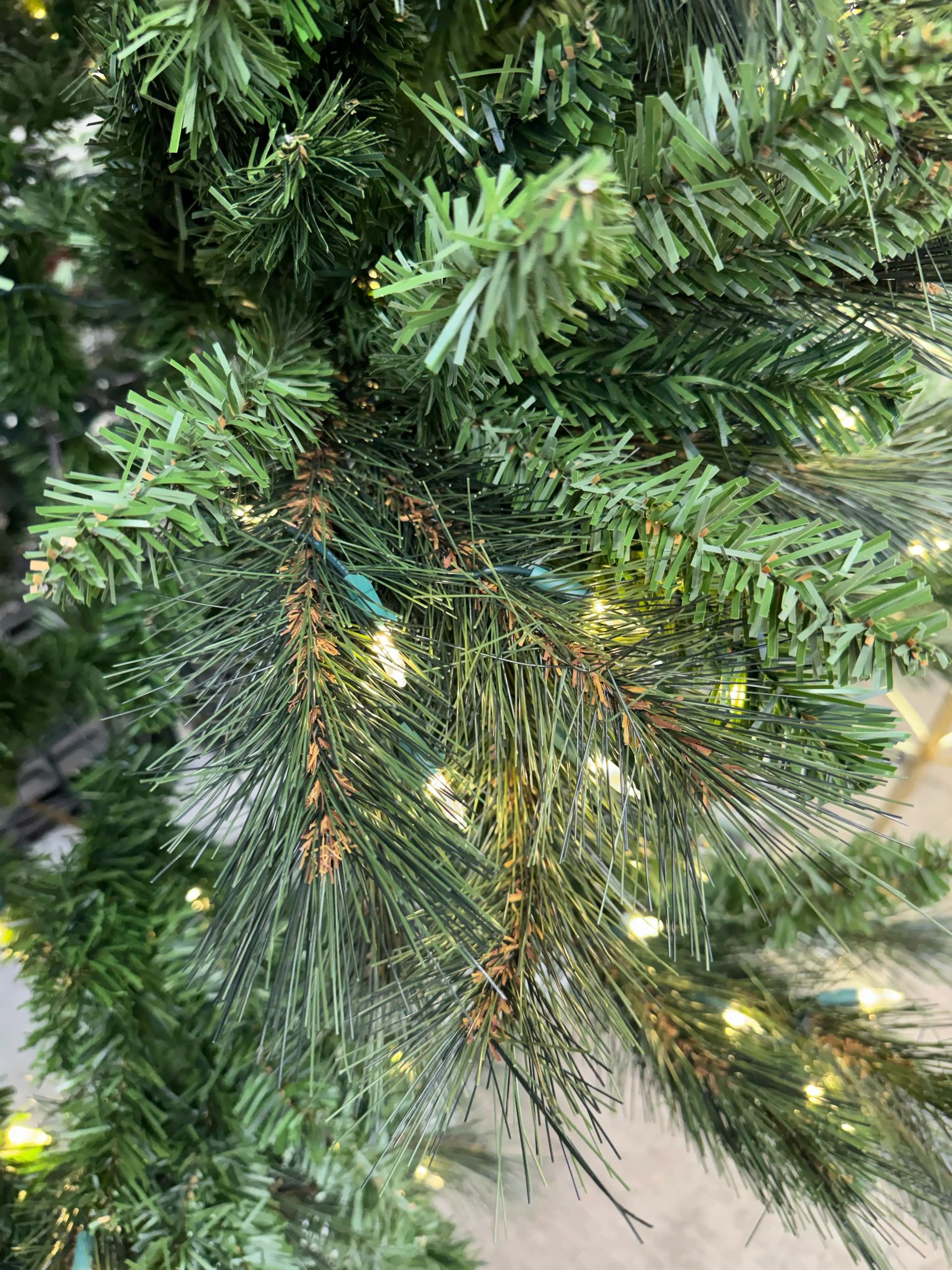 Mixed PVC needles in varying green shades, dense branching with warm white micro LEDs visible throughout, no visible gaps