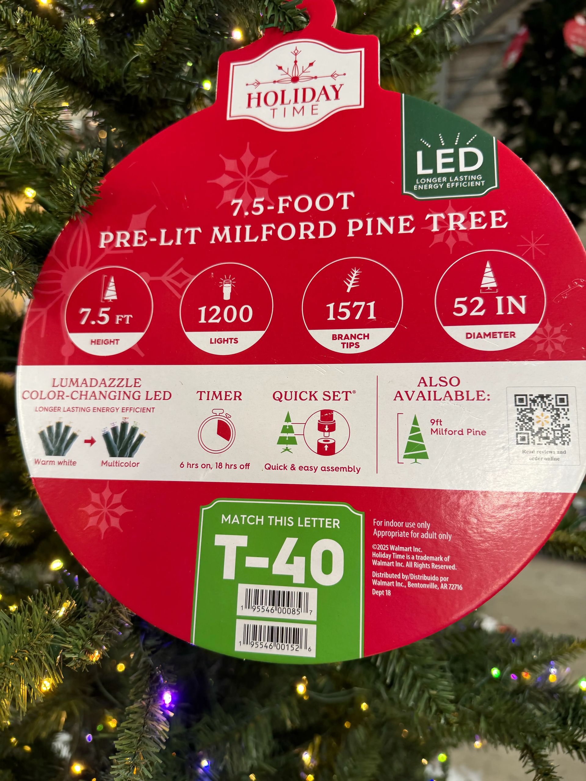 Product tag showing 7.5ft tree specs: 1200 lights, 1571 branch tips, 52in diameter, color-changing LED feature