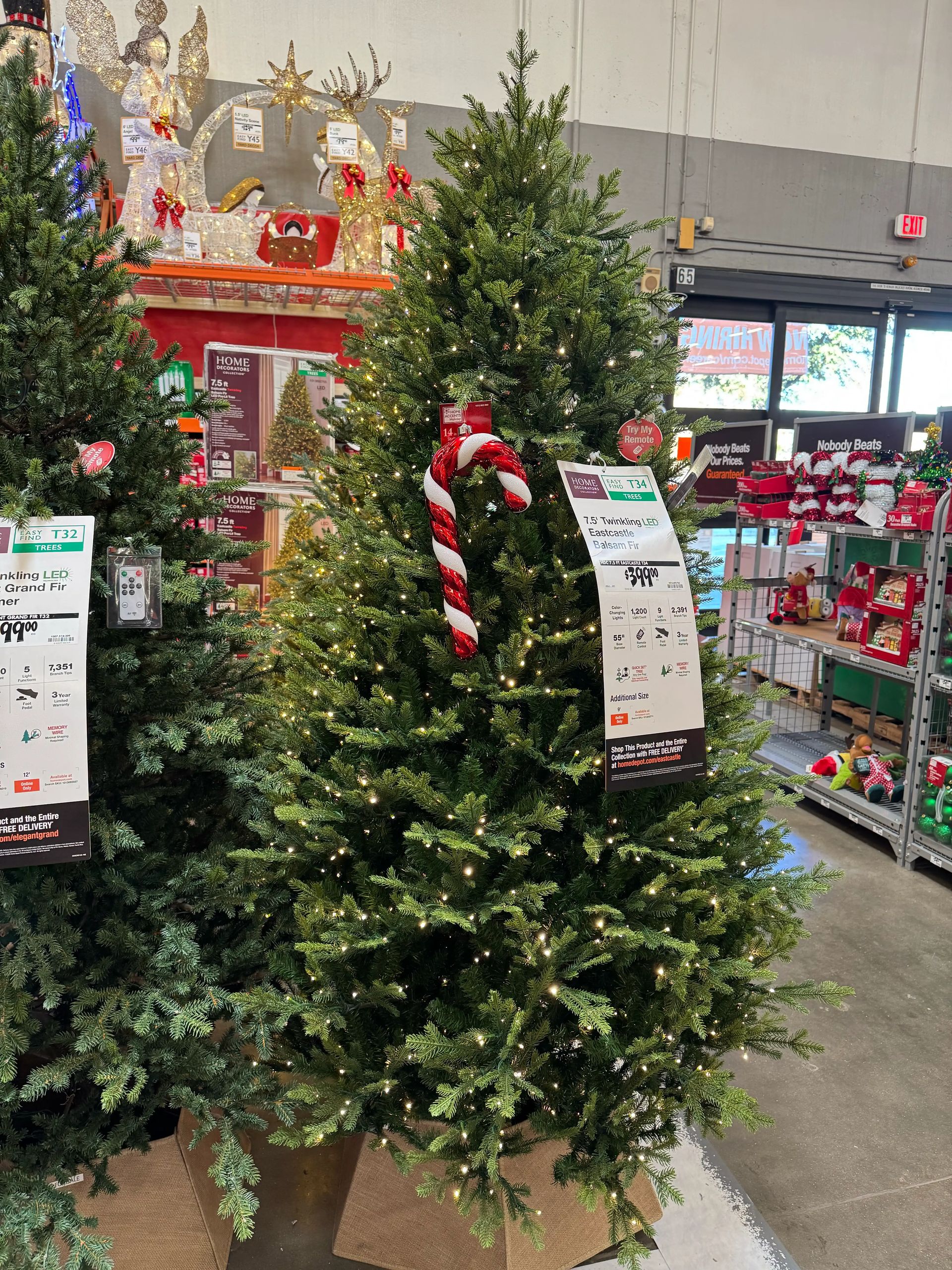 Full fir-style tree with mixed PVC/PE needles, dense branching, warm micro LEDs throughout, candy cane ornament