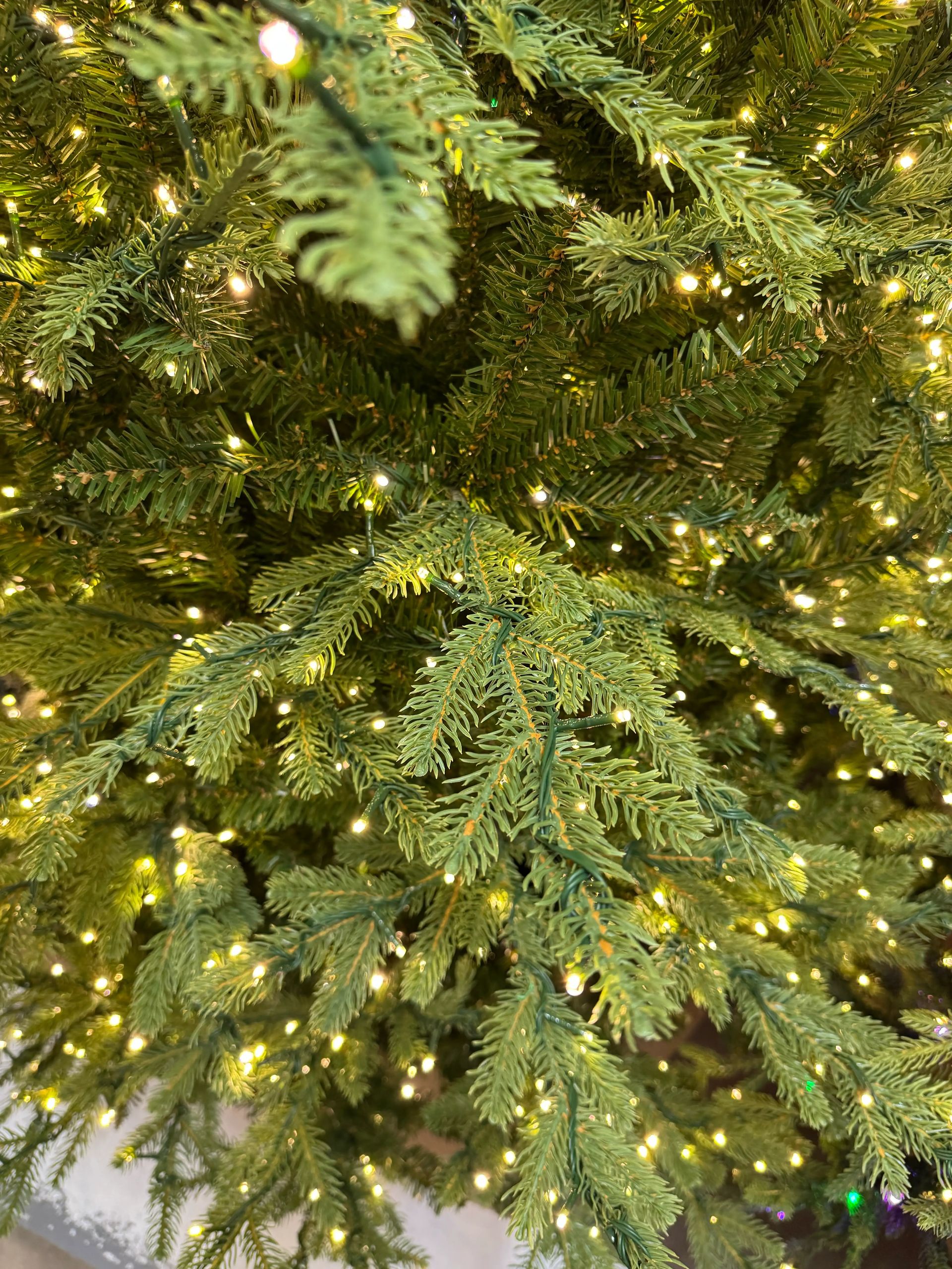 Mixed PVC and molded PE fir needles with warm white micro LEDs densely distributed throughout branches