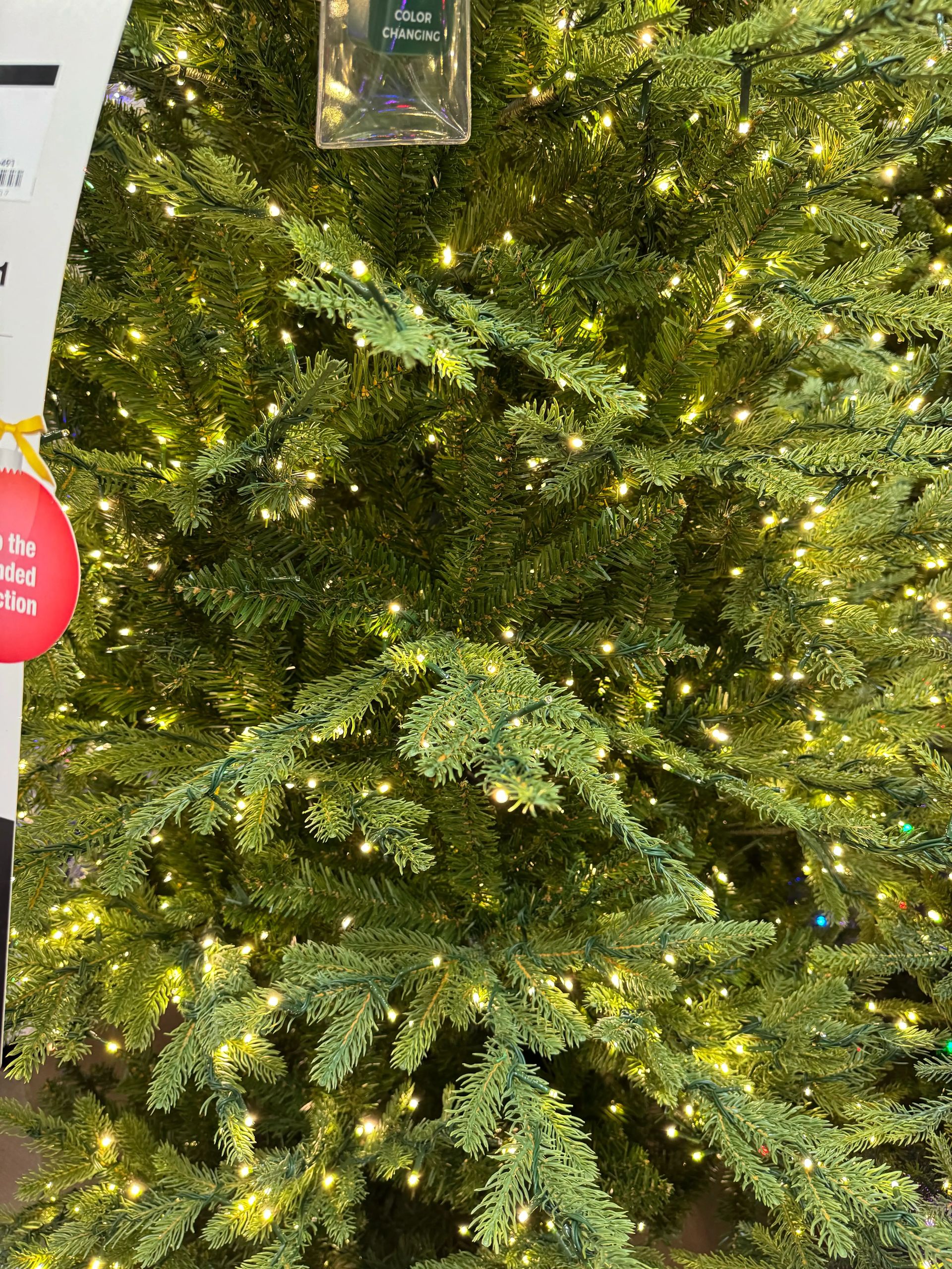 Mixed PVC and molded PE fir needles, dense warm white micro LED coverage throughout branches, minimal visible gaps