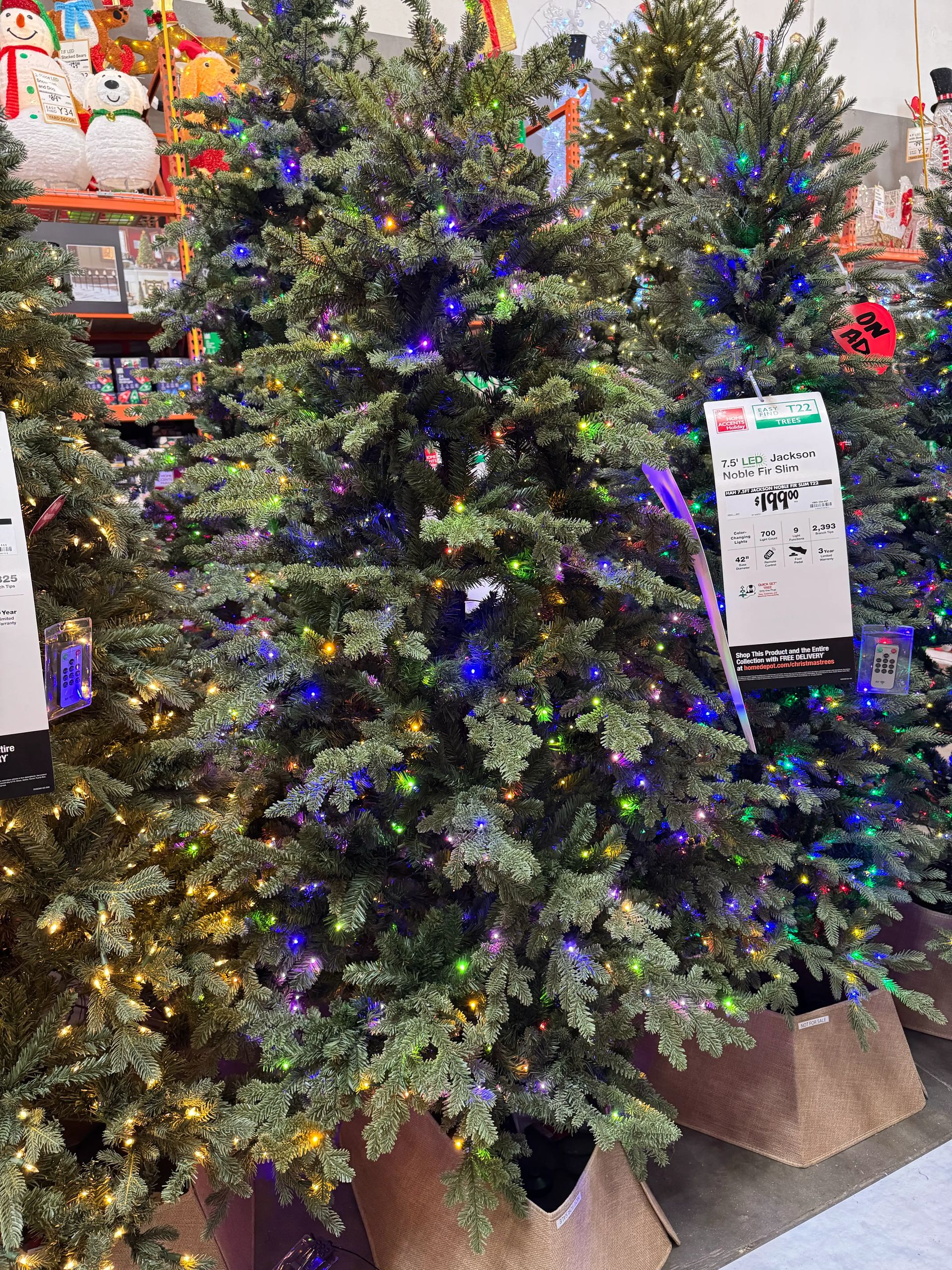 Dense fir-style tree with mixed PVC/PE needles, minimal gaps, heavily lit with multicolor micro LEDs throughout
