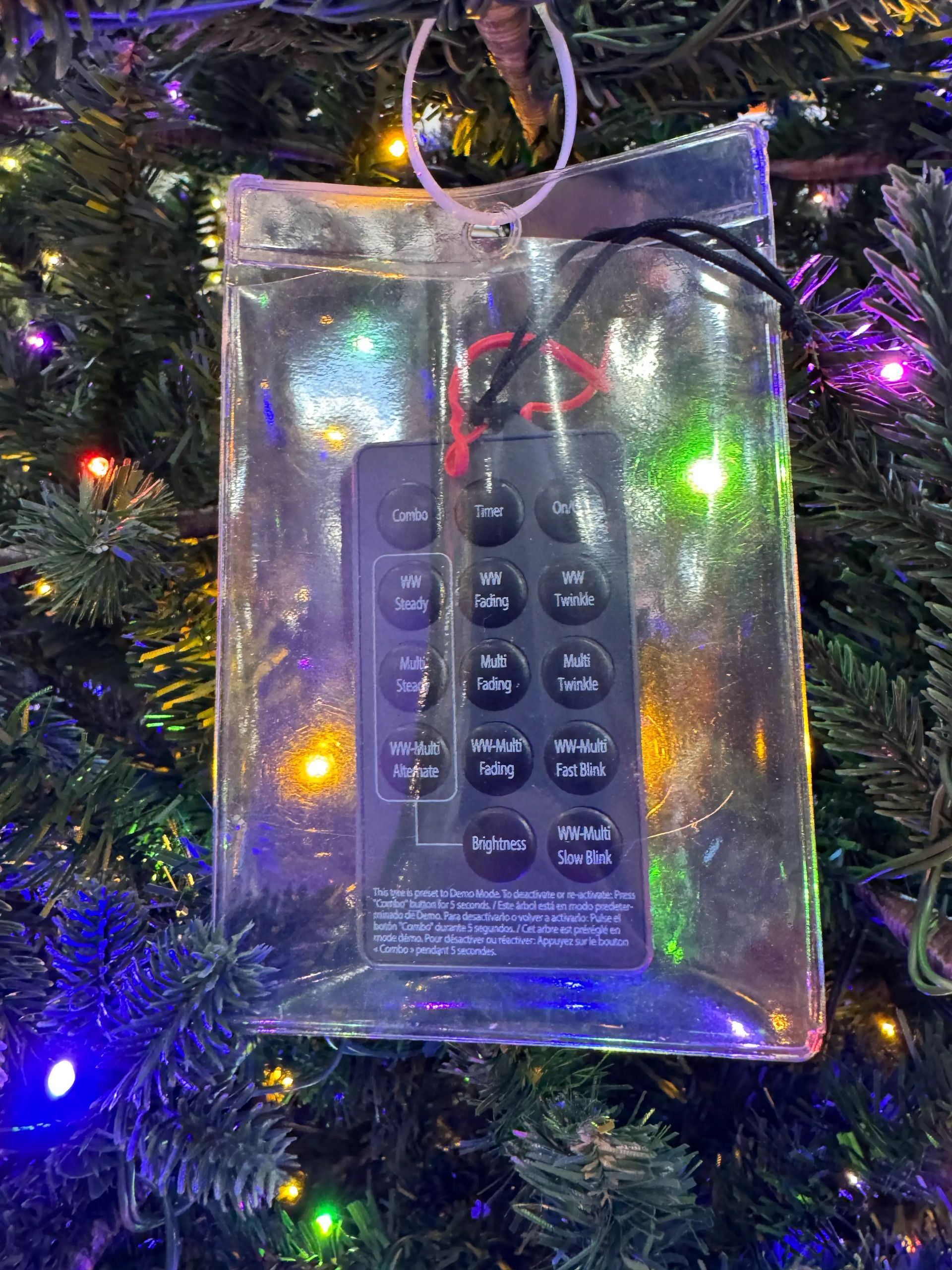 LED remote control in waterproof case showing lighting modes: combo, timer, steady, fading, twinkle, brightness control