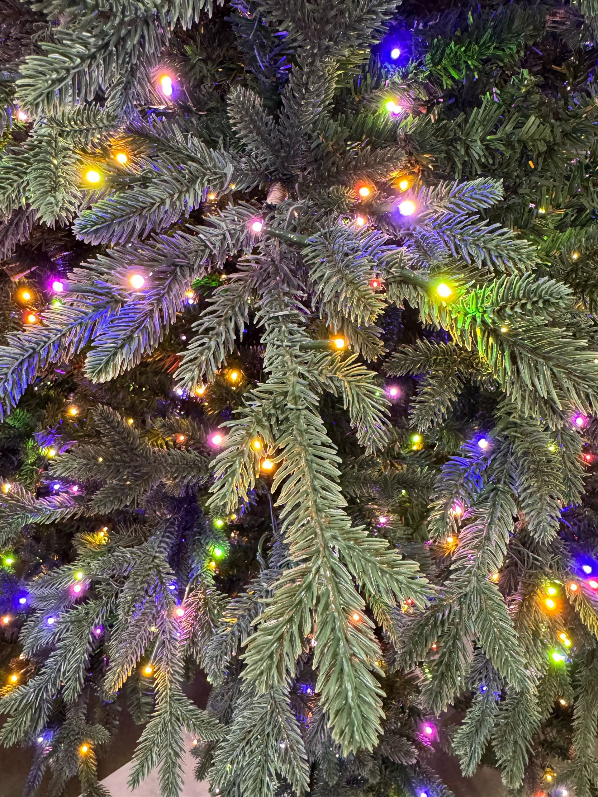 Dense mixed PVC/PE fir needles with multicolor micro LEDs throughout, full coverage with minimal visible gaps