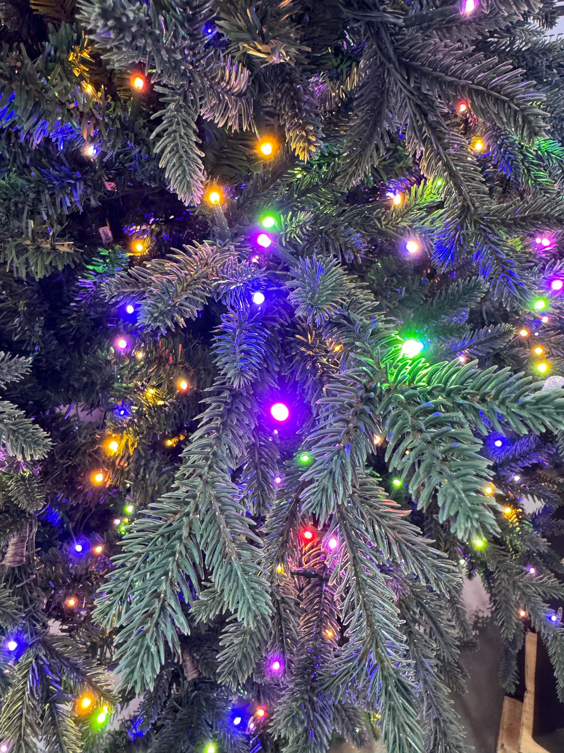 Dense mixed PVC/PE fir needles with multicolor LED lights throughout, minimal visible gaps, full branch coverage