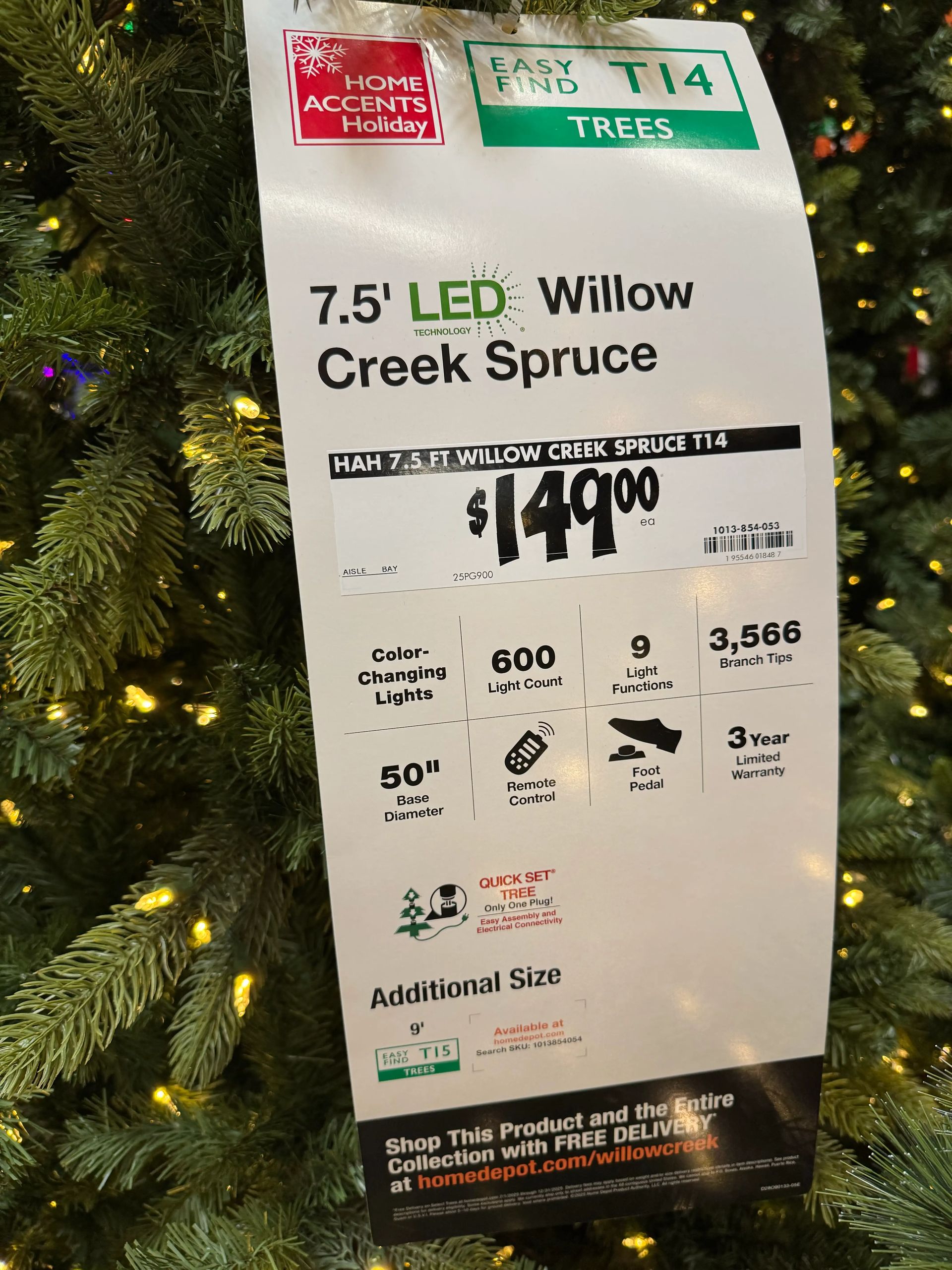 Product tag: 7.5ft tree, 600 lights, 9 functions, 3,566 tips, 50in base, remote control, $149