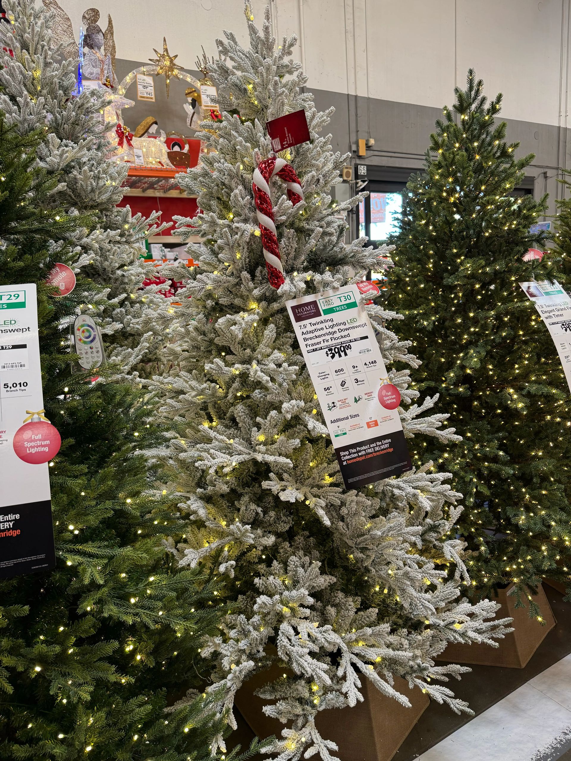 Heavily flocked white fir-style tree with dense PVC branches, warm LED lights, minimal gaps, candy cane topper