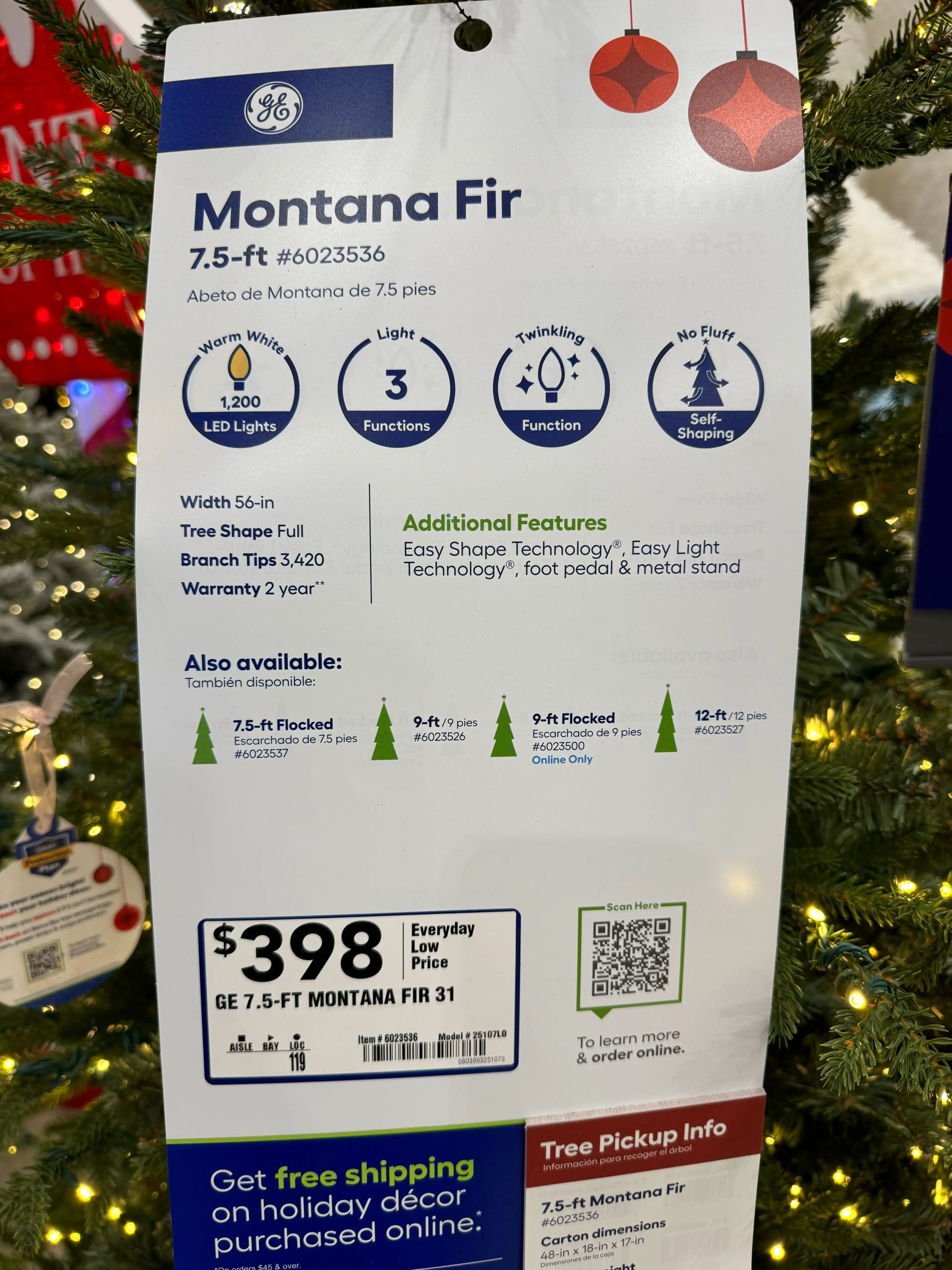 Product tag showing 7.5ft Montana Fir specs: 1,200 LED lights, 3,420 tips, 56in width, $398 price at Lowe's