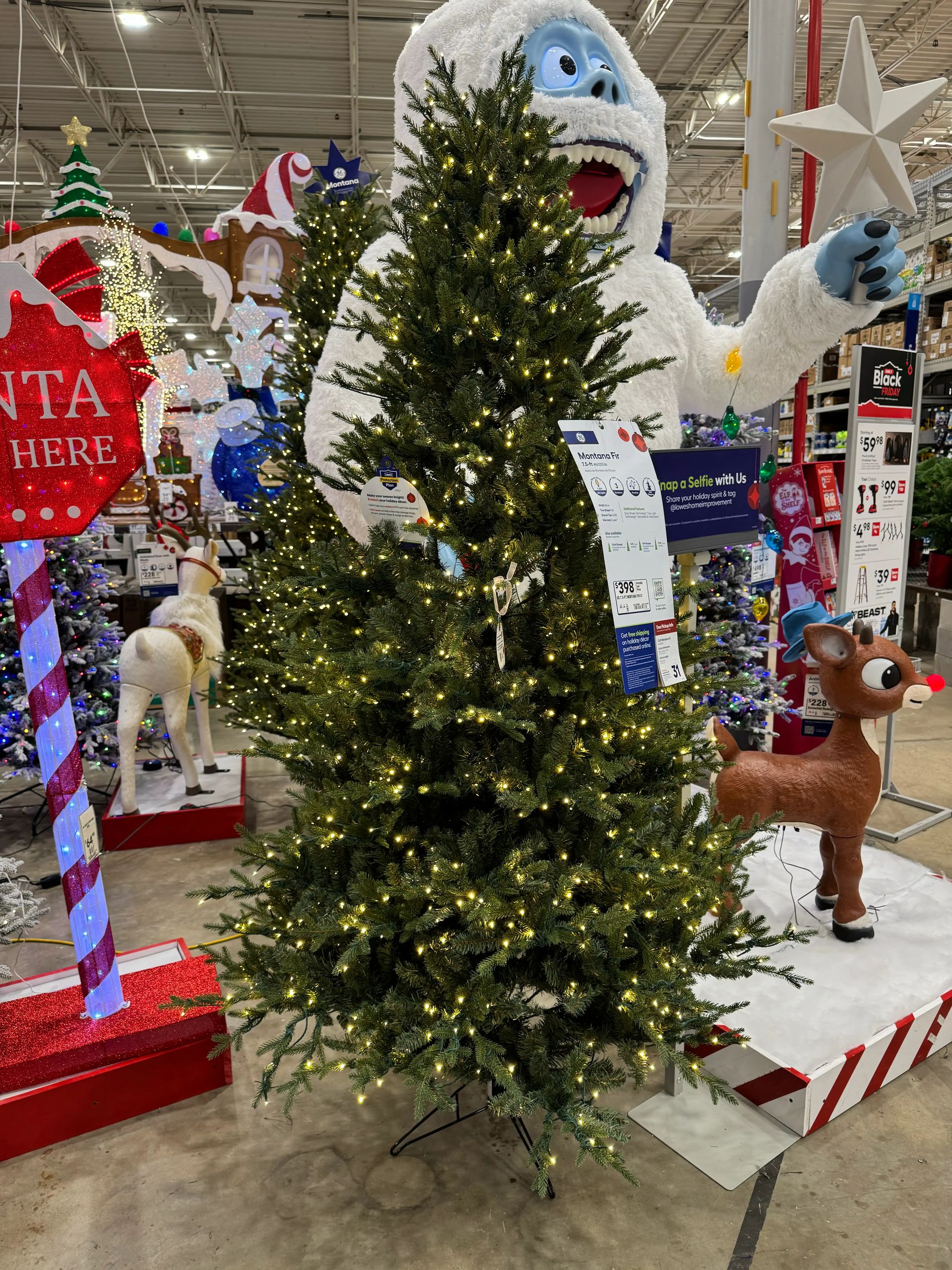 Full fir-style tree with dense PVC branches, heavy warm micro LED coverage throughout, minimal gaps, traditional green