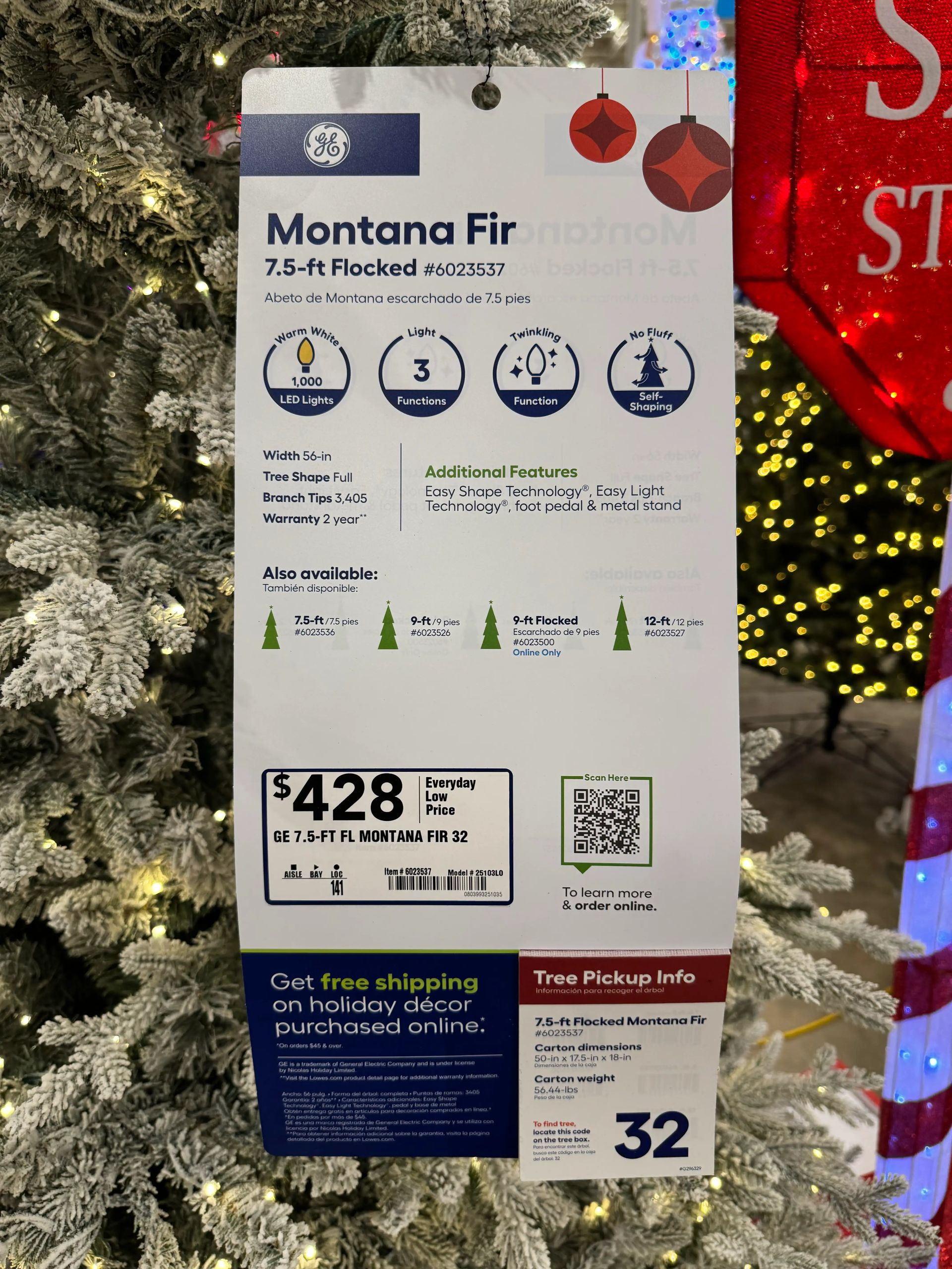 Product tag showing 7.5ft Montana Fir specs: 56in width, 1000 LED lights, 3 functions, $428 price, flocked finish