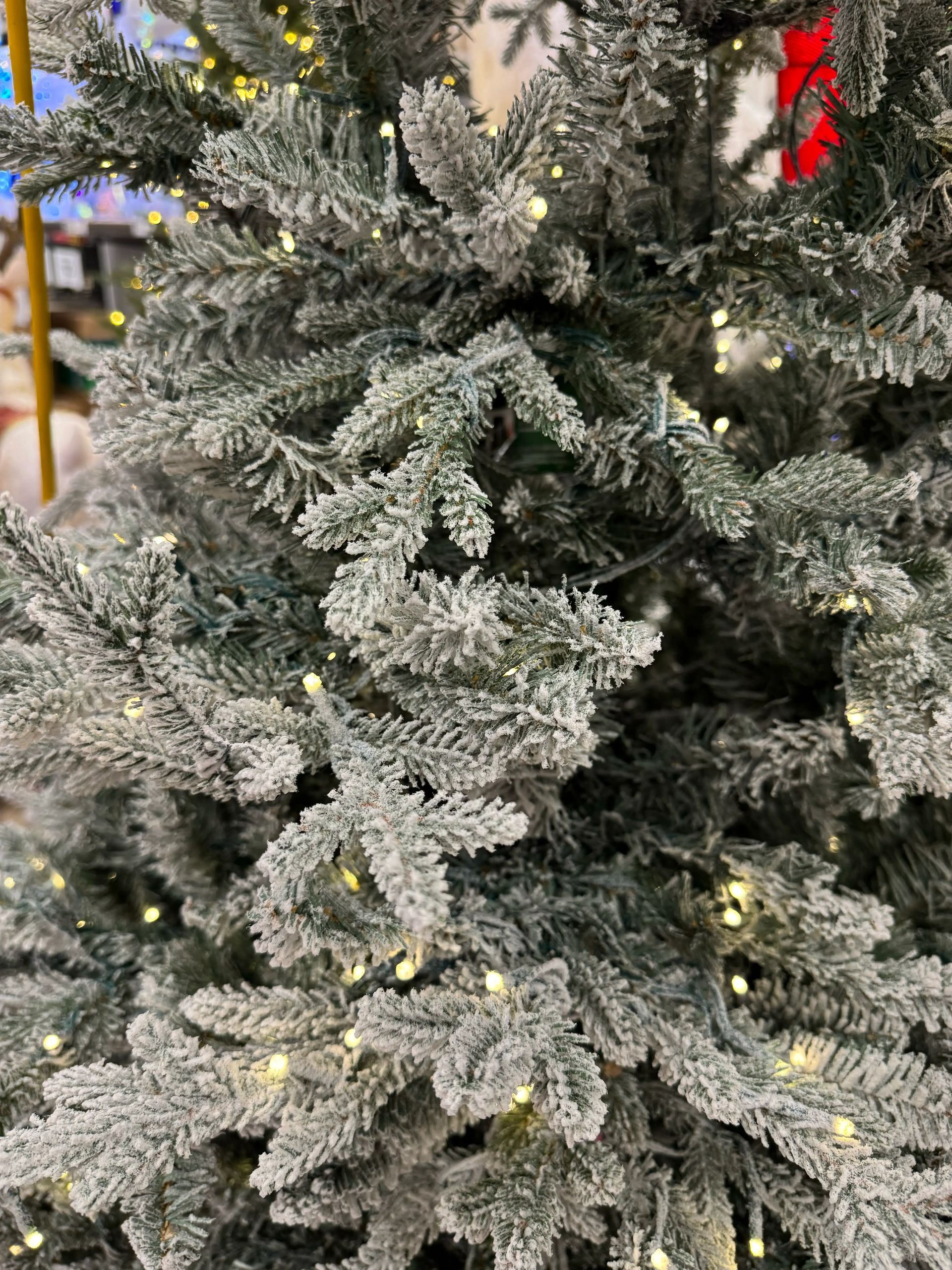 Dense flocked branches with heavy white coating, warm white micro LEDs, mixed PVC/molded tips, realistic texture