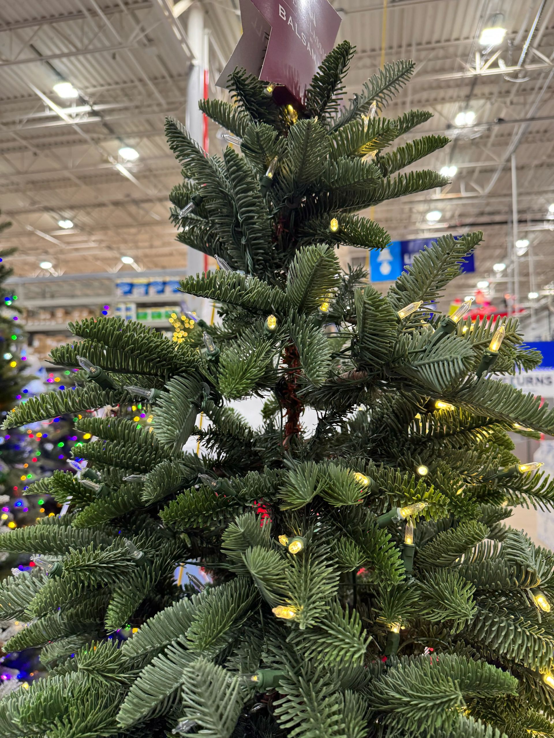 Dense fir-style tree with mixed PVC/PE needles, moderate fullness, warm white micro LEDs throughout, minimal gaps