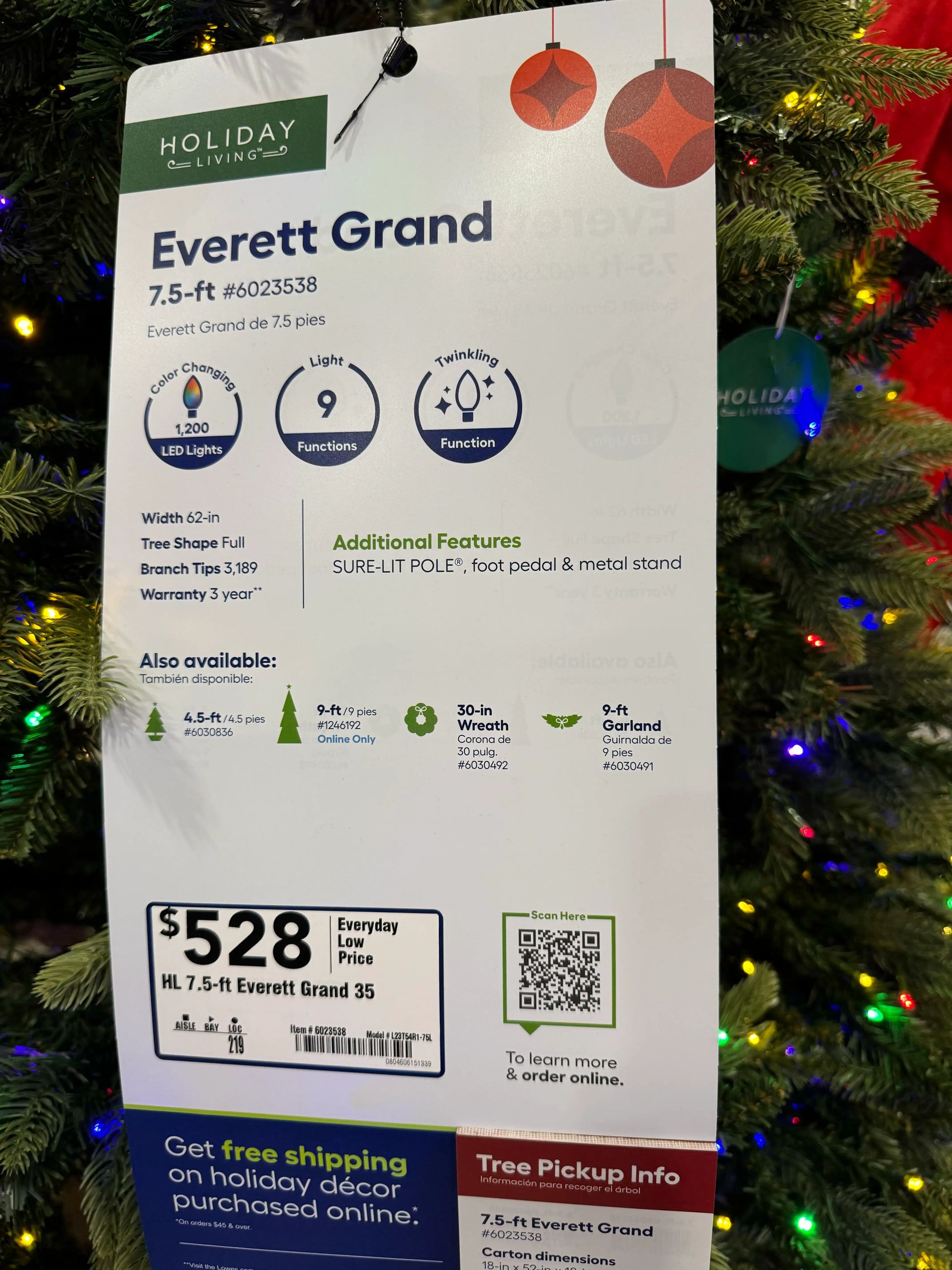 Product tag showing 7.5ft Everett Grand specs: 1,200 LED lights, 9 functions, color-changing, $528 price