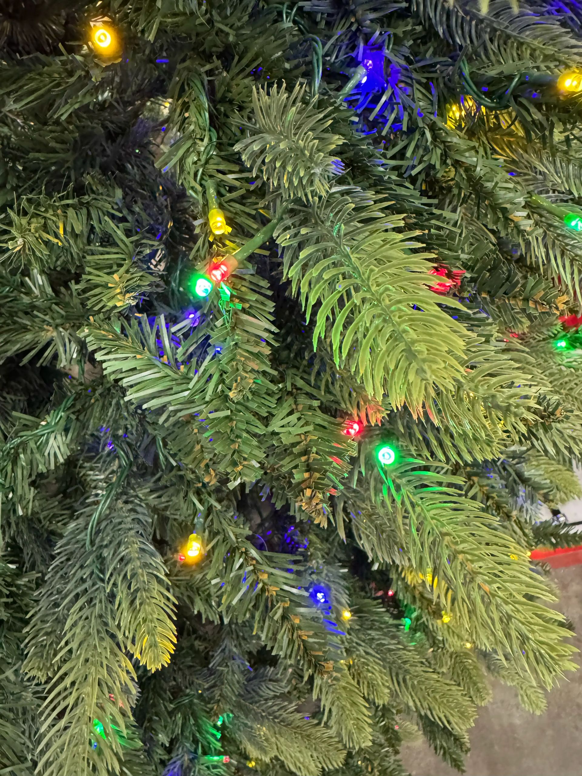 Mixed PVC and PE needle branches with multicolor LED lights, moderate density with some visible gaps between stems