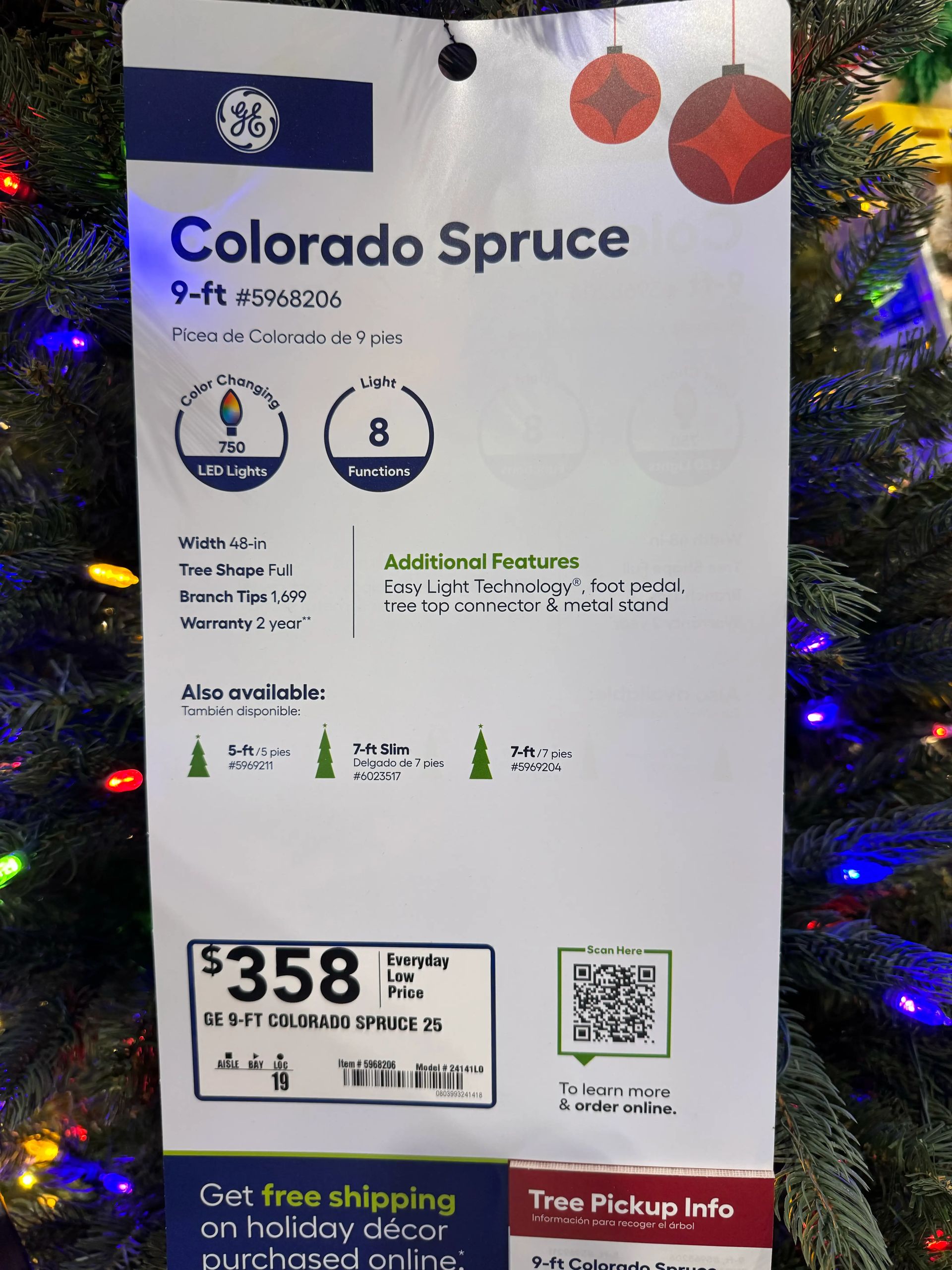 Product tag: 9ft Colorado Spruce, 750 color-changing LEDs, 8 functions, 1,699 tips, $358, 2-year warranty