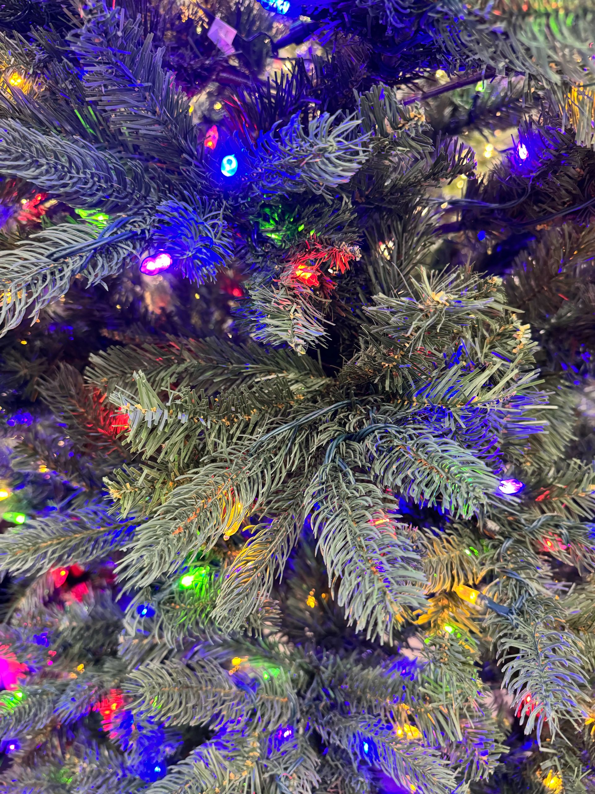 Mixed PVC/PE spruce needles with multicolor mini bulbs, moderate branching density, blue lights prominent