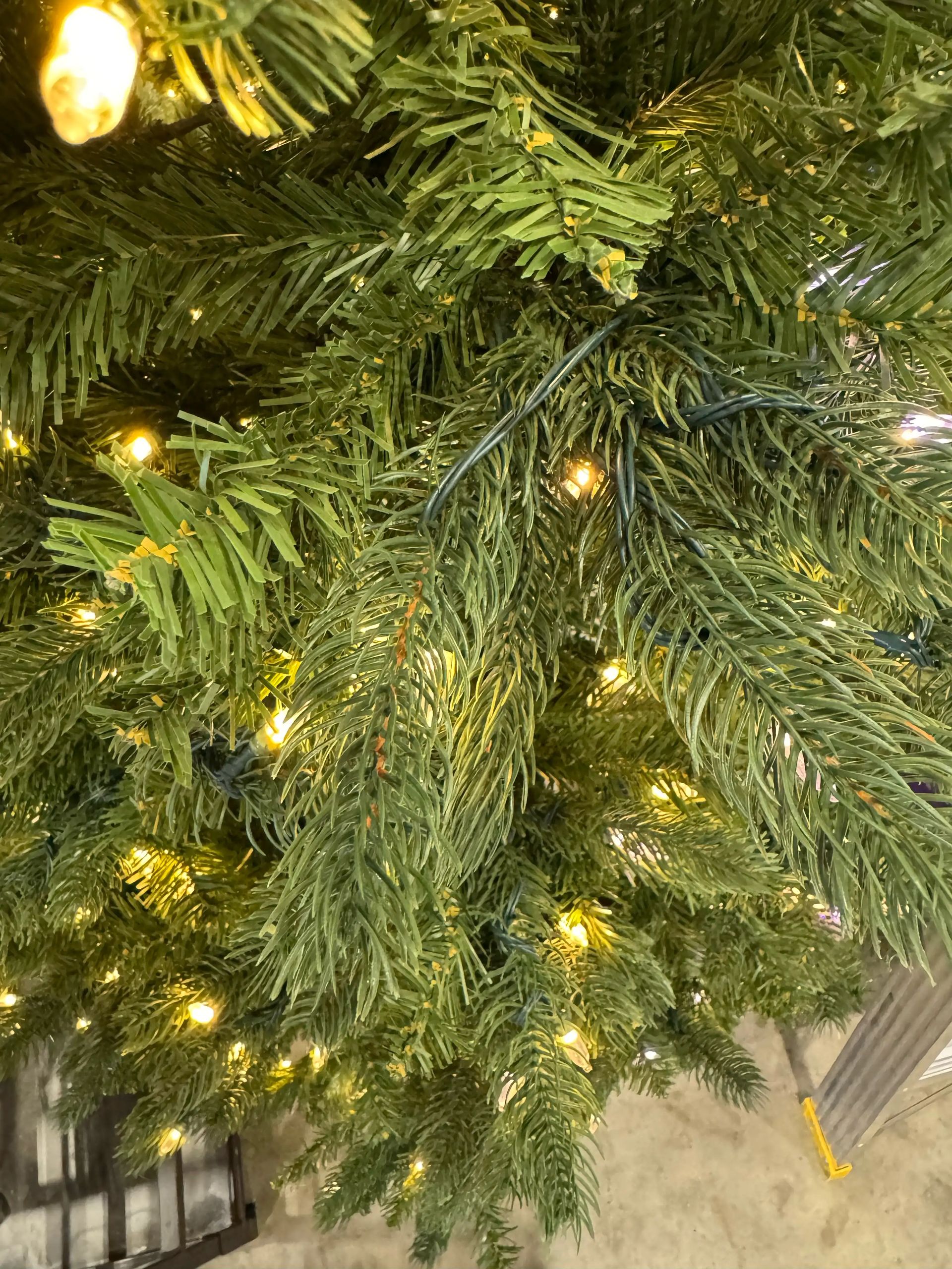 Mixed PVC and molded PE spruce needles, warm white micro LEDs scattered throughout, moderate branch density