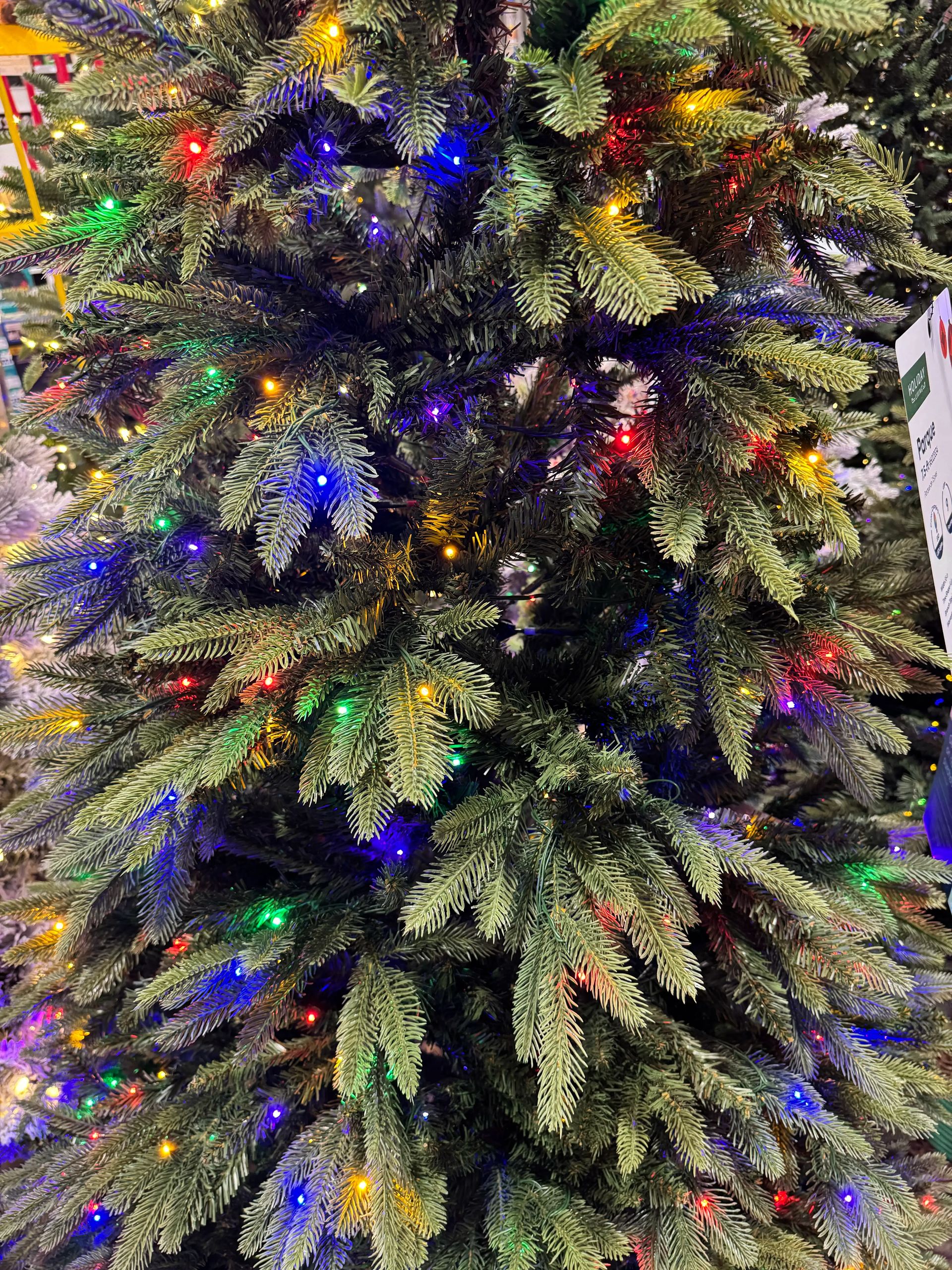 Dense mixed PVC/PE needles with multicolor LED lights throughout, full branching with no visible gaps