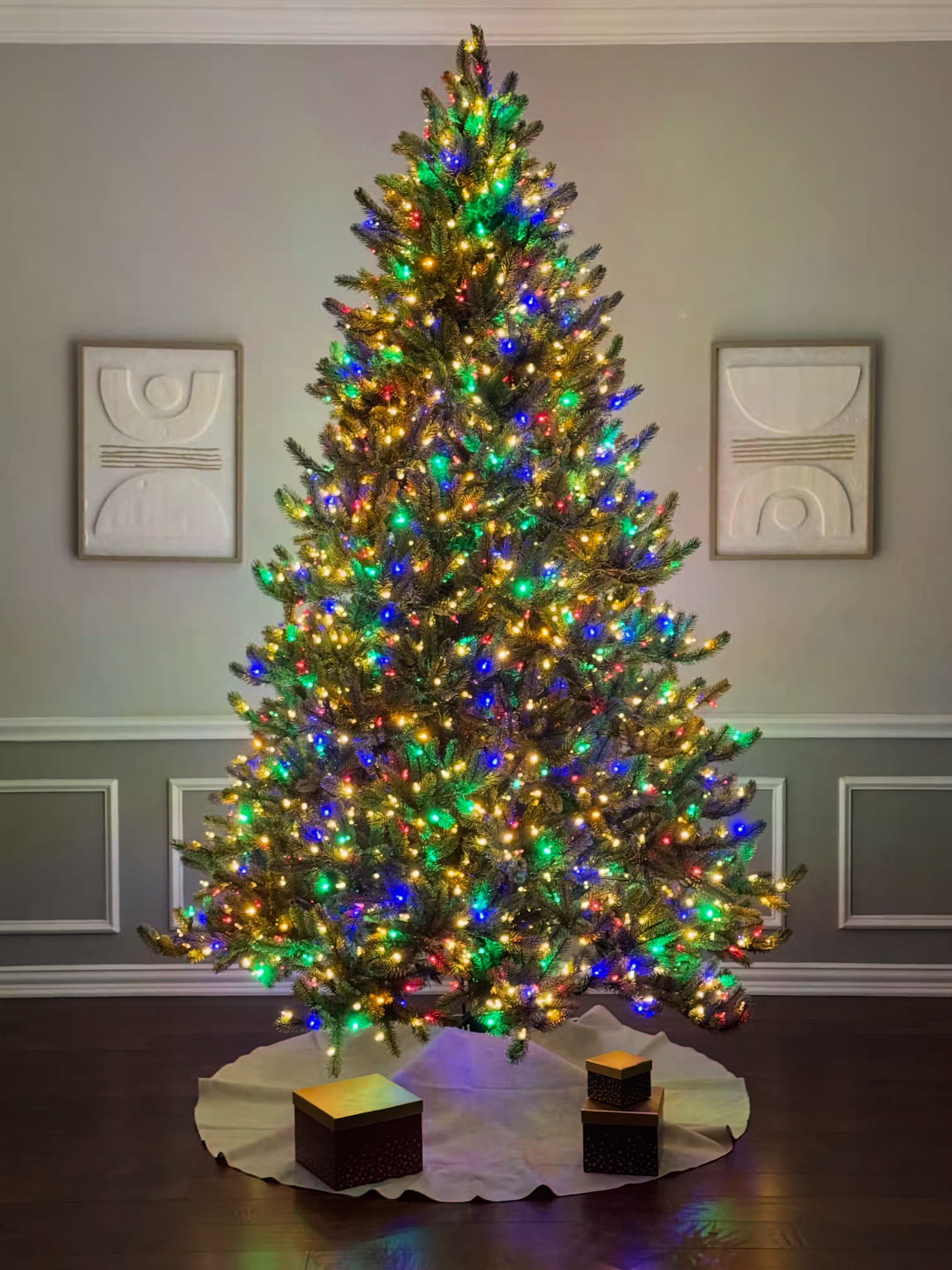 Room lights off with color+clear lights on; very brightly lit with a neutral lighting cast on the wall.