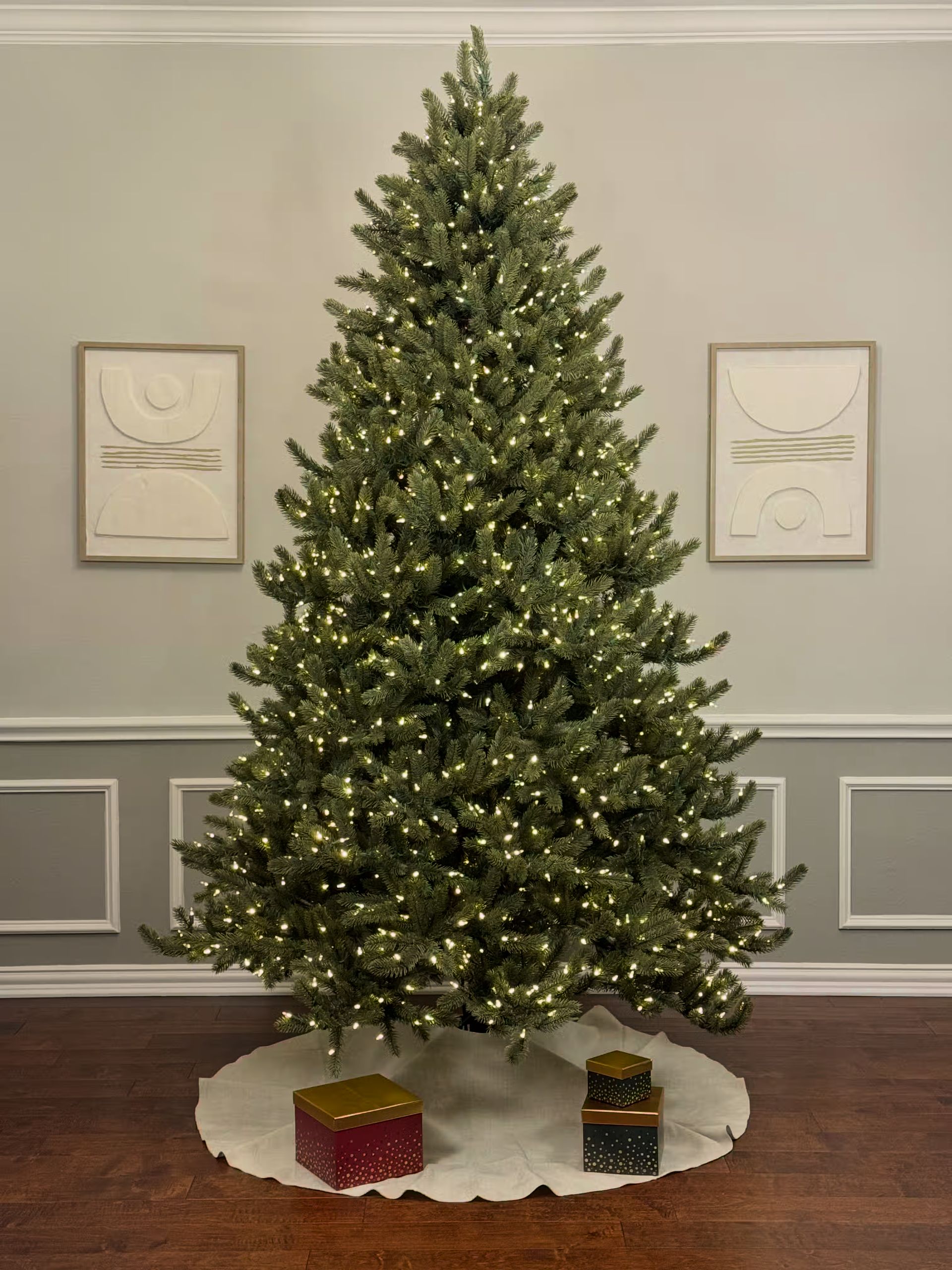 Room lights on with a very dense 8ft tree with white lights also on.